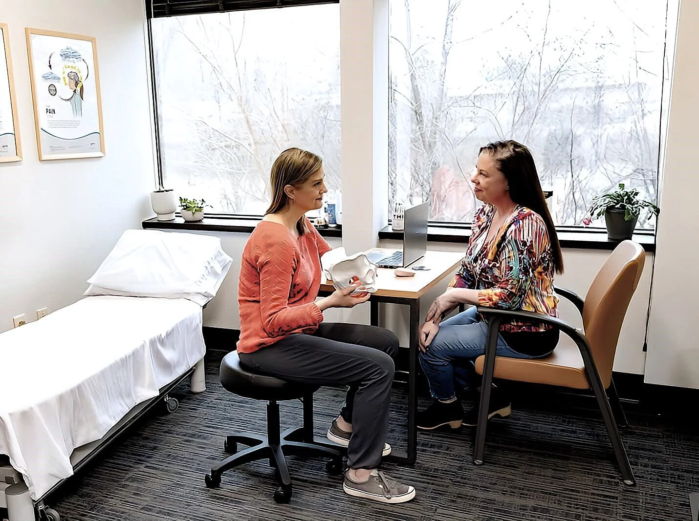 Bethany Hansen educating a patient about pelvic floor physical therapy